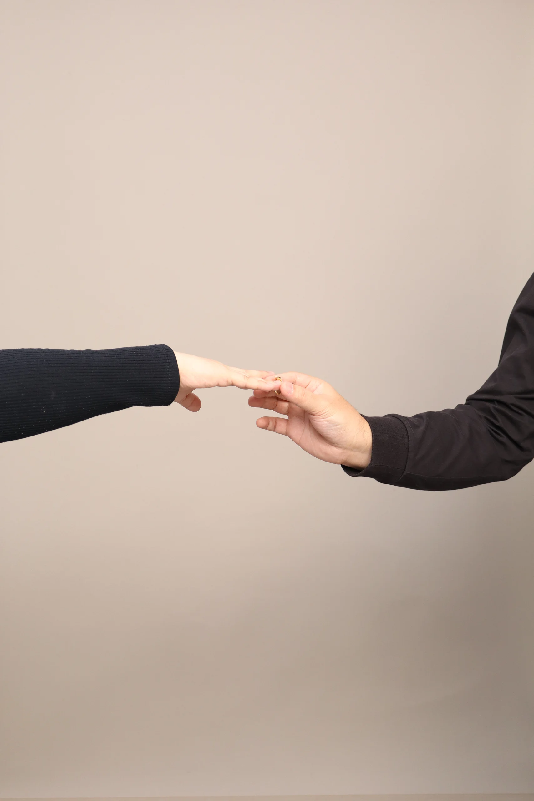 Mario and Inah reaching toward each other’s hands
