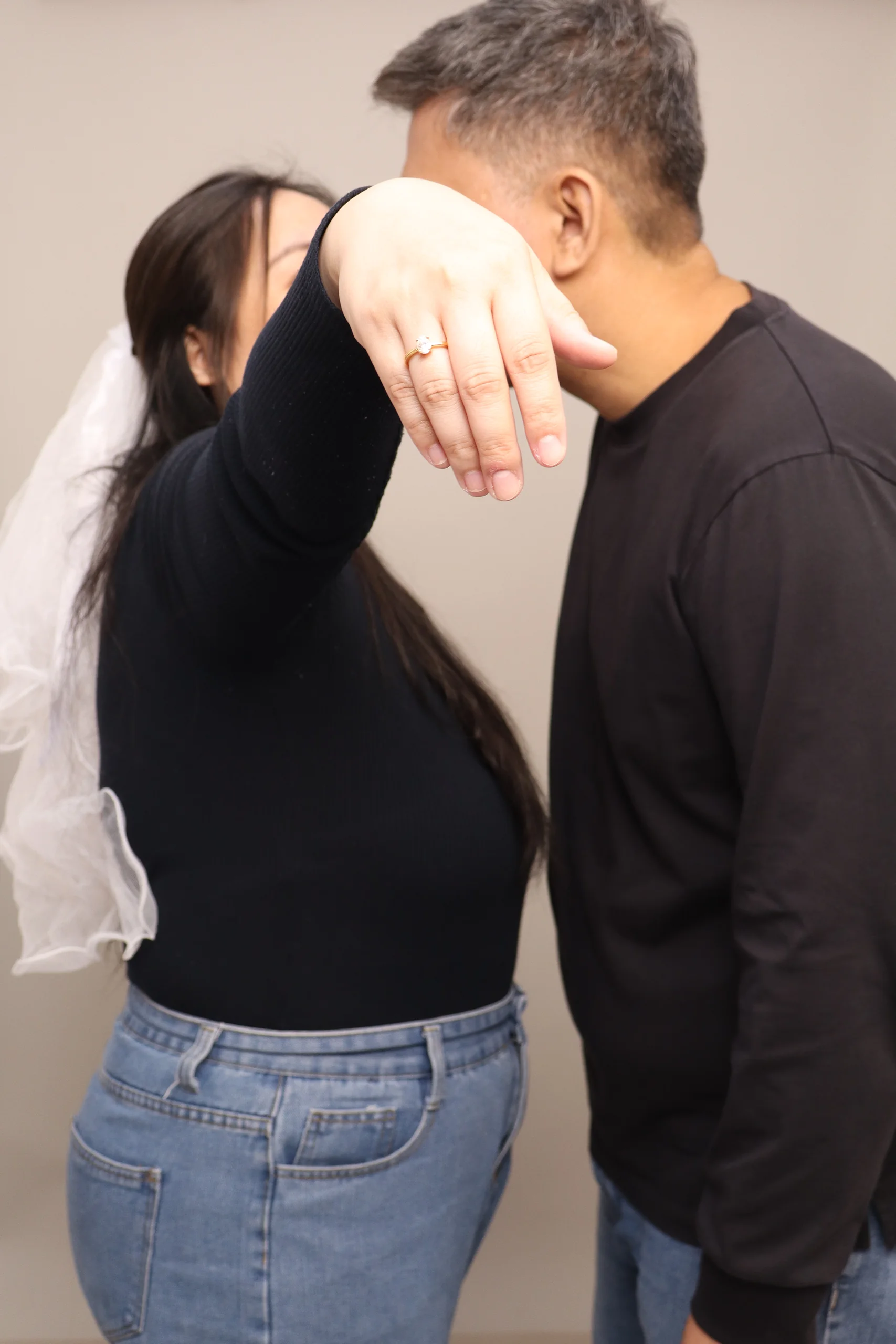 Inah showing her ring while Mario kisses her